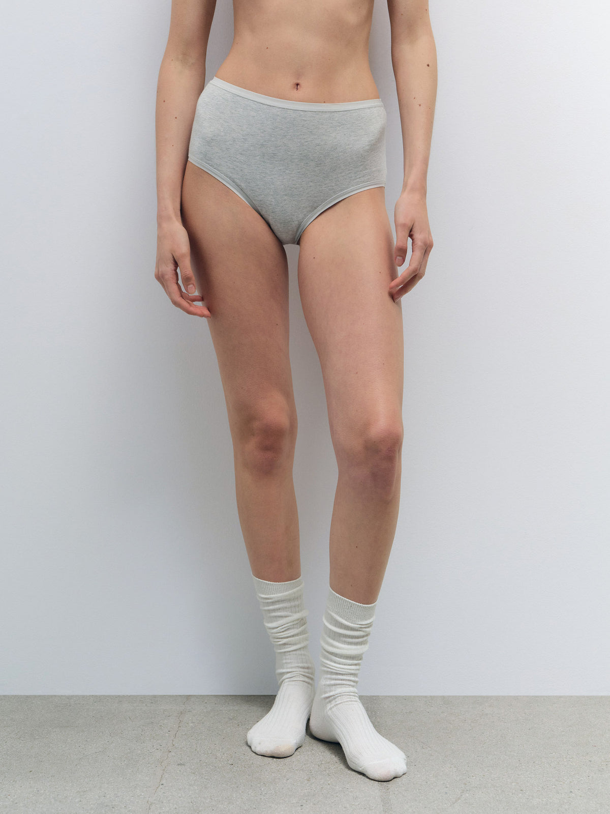 Model wearing light gray Organic Comfort High Waist Brief made from smooth organic cotton jersey.
