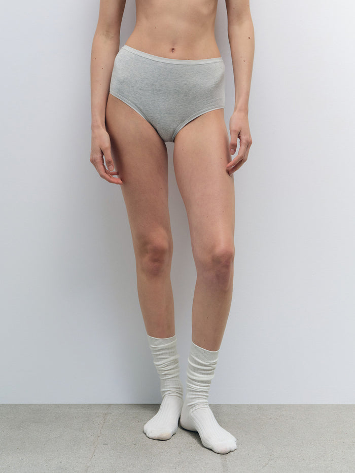 Model wearing light gray Organic Comfort High Waist Brief made from smooth organic cotton jersey.
