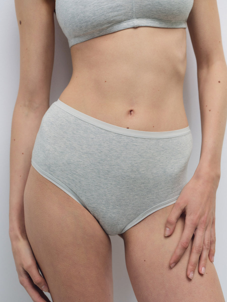 Light grey organic cotton high waist brief with smooth fit, shown on a model.