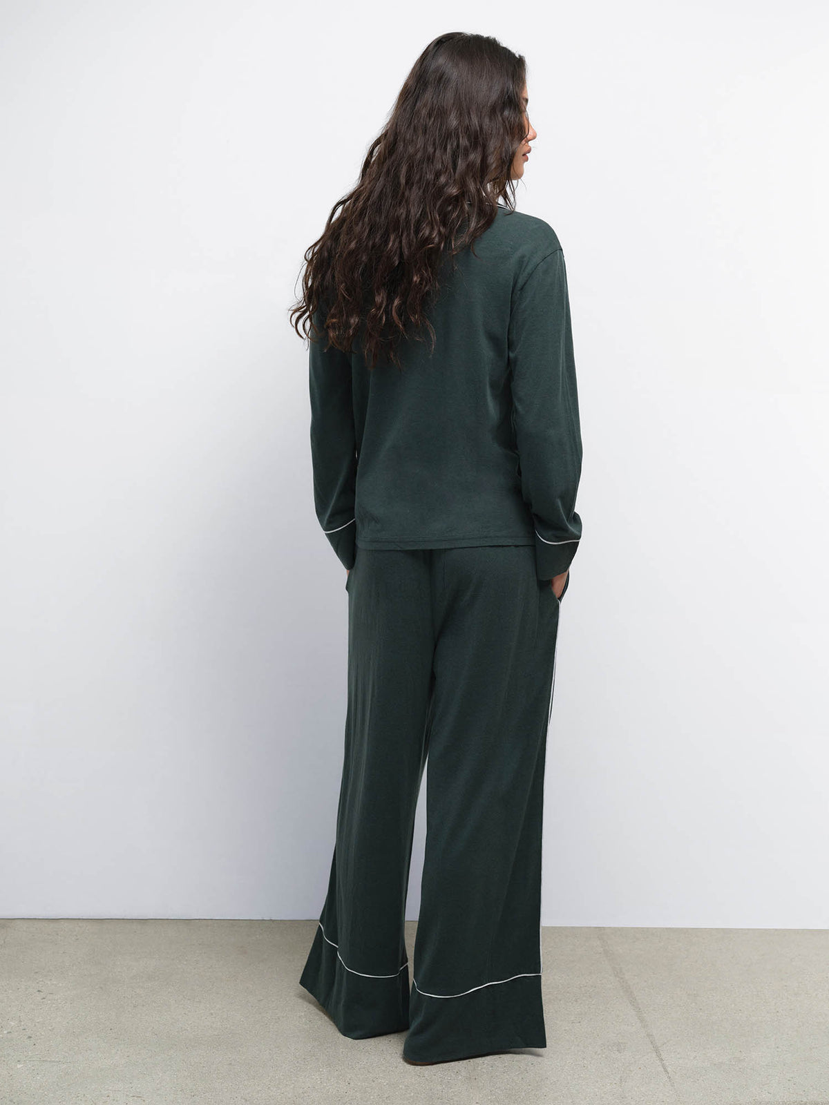 Back view of model wearing the Tencel Sleep Set in Balsam with Heather Grey piping