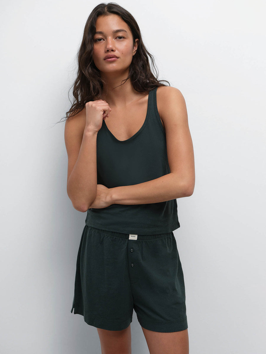 Model with hand at her chest wearing the Tencel Sleep Scoop Tank and Boxer Short in Balsam