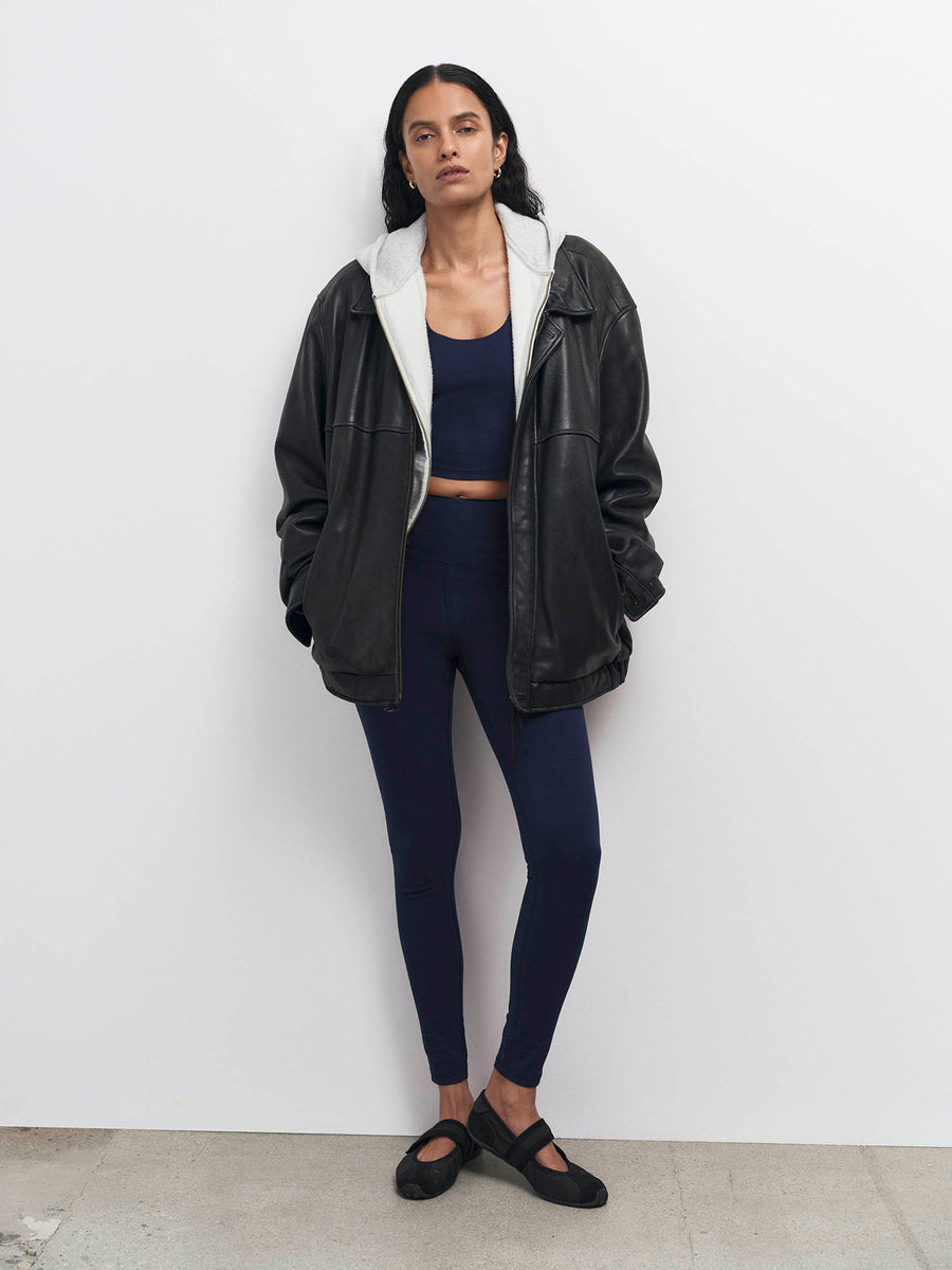 Midnight navy organic sports bra and midi leggings styled with a black leather jacket – MATE the Label