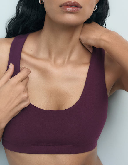 Close-up of a fig organic stretch scoop-neck sports bra – MATE the Label