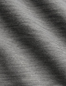 Merino fabric detail, showing the fine, lightweight texture of merino wool.