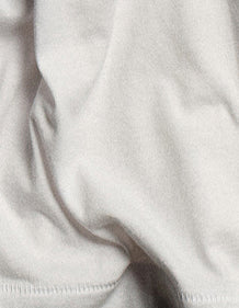 Organic Pima fabric detail, showing the smooth, lightweight texture of regenerative organic cotton.