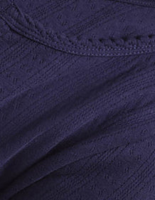 Organic Pointelle fabric detail, showing the breathable textured knit made from organic cotton.